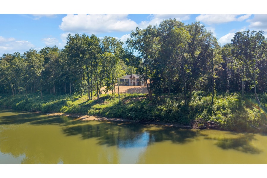 Custom home on a cleared wooded hillside lot in East Tennessee by Idell Construction