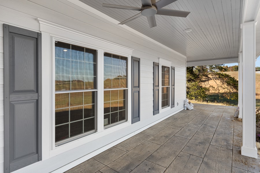 High-quality vinyl windows on a custom home porch by Idell Construction
